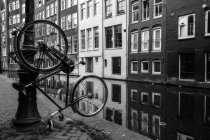 Hanging bicycle, the dutch symbol, Amsterdam, Holland — Stock Photo