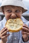 Child eating pancake — Stock Photo