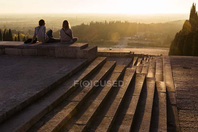 Tourists sitting at Military Memorial of Redipuglia — Stock Photo