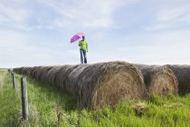 Woman Standing On Hay Bales — Stock Photo