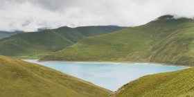 Hilly landscape and sacred lake — Stock Photo