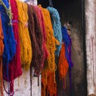 Yarn hanging against wall — Stock Photo