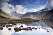 Mountains And Lake with stones — Stock Photo
