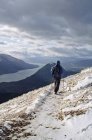 Hiker On Snowy Trail — Stock Photo