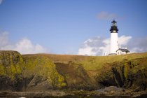 Lighthouse on hill top — Stock Photo