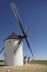 Windmills  in row on field — Stock Photo
