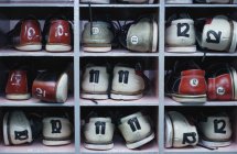 Shelf with all sizes bowling shoes for hire — Stock Photo