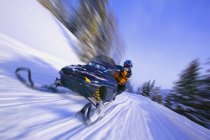 Person On  Snowmobile riding — Stock Photo