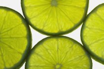 Fatias de limão verde — Fotografia de Stock