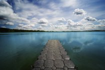 Dock against water and sky — Stock Photo