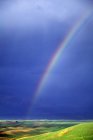 Rainbow in blue sky — Stock Photo
