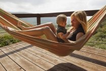A Mother In A Hammock With Her Young Son — Stock Photo