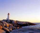 Lighthouse on top of rock — Stock Photo
