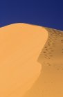 Sand Dune with footsteps — Stock Photo