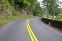 Winding Road Surrounded By Rock — Stock Photo