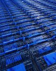 Lot of shopping carts placed in rows at parking — Stock Photo