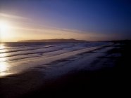 Praia de Malahide e cabeça de crescimento ao nascer do sol — Fotografia de Stock