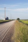 Gravel Road With Silos In Distance — Stock Photo