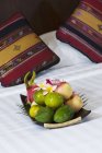 Chiang Mai, Thailand; A Plate Of Fruit Sitting On A Bed At Horiz — Stock Photo