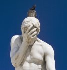 Pigeon Sitting On Statue Of A Man — Stock Photo