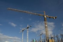 Cranes outdoors against sky — Stock Photo