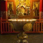 Candles burning in drepung monastery — Stock Photo
