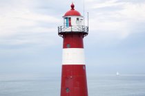 Red and white lighthouse — Stock Photo