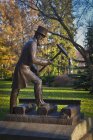 Bronze statue of railroad official hammering — Stock Photo