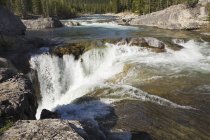 Mountain waterfalls and rushing river — Stock Photo
