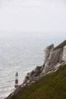 Leuchtturm und Strandkopf — Stockfoto