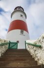 Steps Leading Up To Red And White Lighthouse — Stock Photo