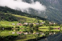 Houses In A Valley Along The Water — Stock Photo