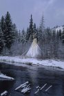 Teepee Stands By Small River — Stock Photo