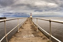 Lighthouse At The End Of Pier — Stock Photo