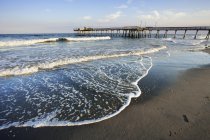 View Of Beach And Pier At Sunset — Stock Photo