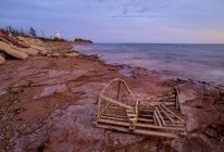 Point Prim Lighthouse And Old Lobster Trap — Stock Photo
