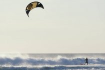 Adult extreme female athlet on kitesurfing board. Tarifa, Cadiz, Andalusia, Spain — Stock Photo