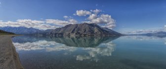 Sheep mountain reflected in waters — Stock Photo
