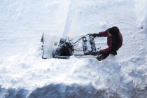 Top view of man using a snowblower — Stock Photo
