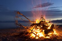 Bonfire on beach at Golden Bay — Stock Photo