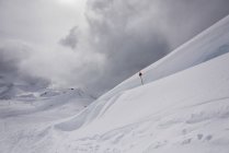 Drifting snow on mountain top — Stock Photo