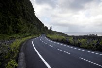 Seafront road under dramatic sky — Stock Photo