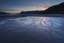 Patterns in the mudflats at dusk — Stock Photo