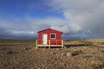 Red cabin on tundra — Stock Photo