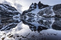 Reflections of snow mountains — Stock Photo