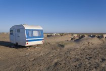 Camping trailer on beach — Stock Photo
