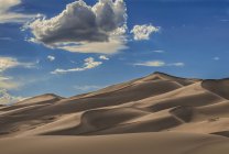 Sand dunes in afternoon sun — Stock Photo