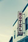 Hotel sign on the side of building — Stock Photo