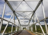 Metal Bridge over the Racing River — Stock Photo