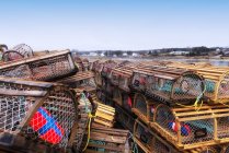 Lobster traps stacked on wharf — Stock Photo